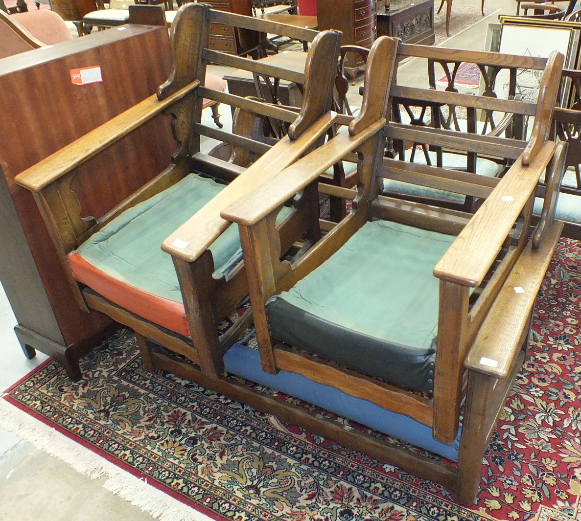 A 1950's style oak two-seater settee and two armchairs, frames only.