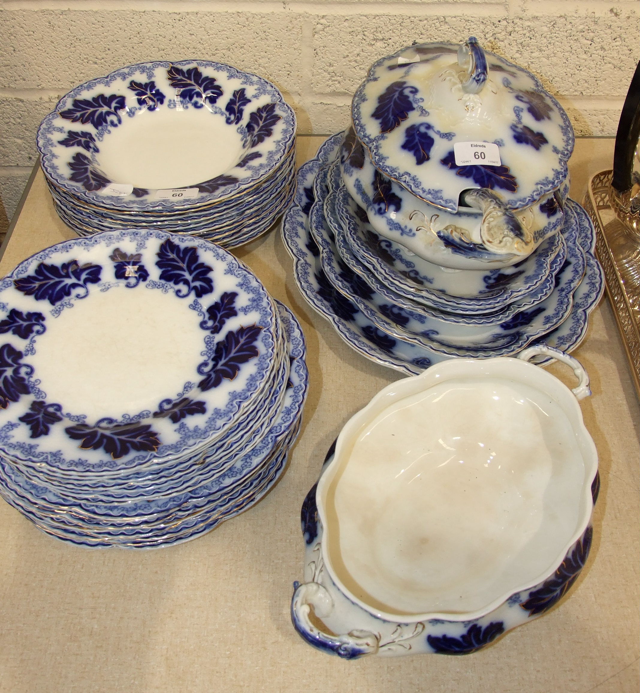 Thirty-five pieces of Johnson Bros "Normandy" blue and white dinnerware, including a soup tureen and