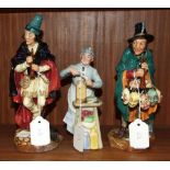 Three Royal Doulton figures, "The Mask Seller" HN2103, 22cm, "The Pied Piper" HN2102, 22.5cm, and "A