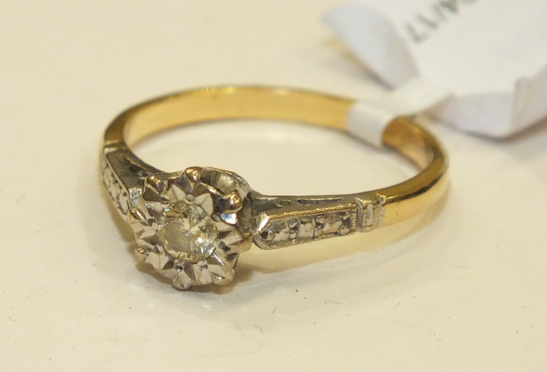 A solitaire diamond ring, the illusion set brilliant cut diamond in 18ct gold mount, size O, 3.1g.