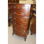 A modern mahogany finish bow-front narrow chest of six drawers on short cabriole legs, 50cm wide,