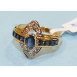 A modern sapphire and diamond ring claw set an oval sapphire with diamond point set marquise frame