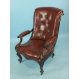 A Victorian rosewood salon chair, the foliate-carved frame with scrolling arms and Rexine-