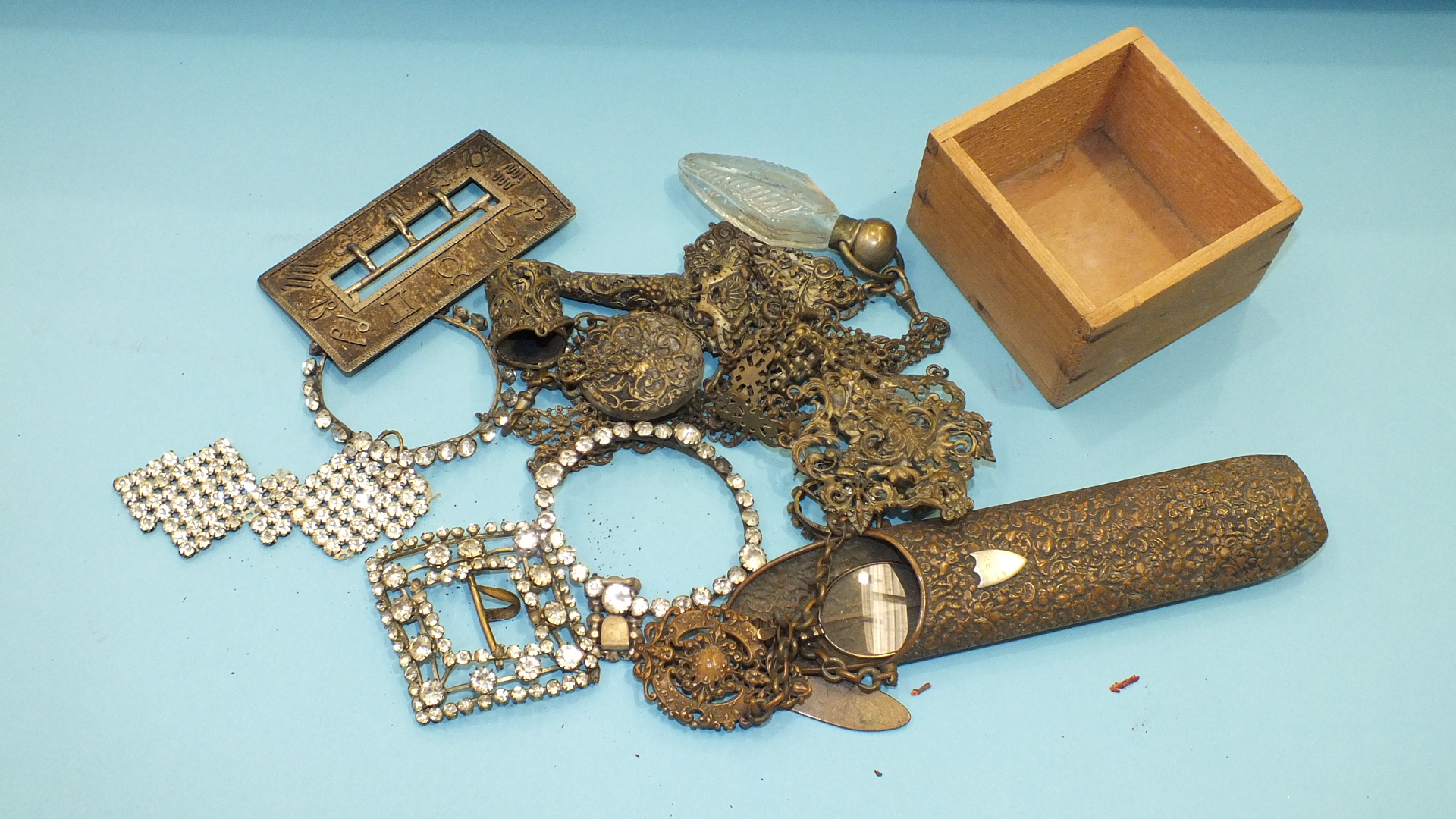 A plated metal chatelaine, a paste buckle and other items.