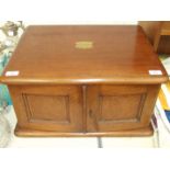 A Late-Victorian oak canteen box fitted with a pair of doors revealing three fitted graduated