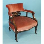 An Edwardian inlaid mahogany armchair, the upholstered high wing back and seat on square tapered