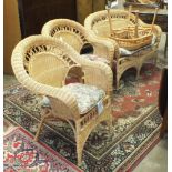 A rattan two-seater conservatory settee and two matching armchairs, (3).