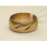 A 9ct gold wedding band, size P, 8.6g.