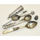 A silver cheroot case with amber cheroot holder, a silver teaspoon with Prince of Wales feathers and