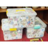 A large quantity of loose stamps contained in three plastic boxes.