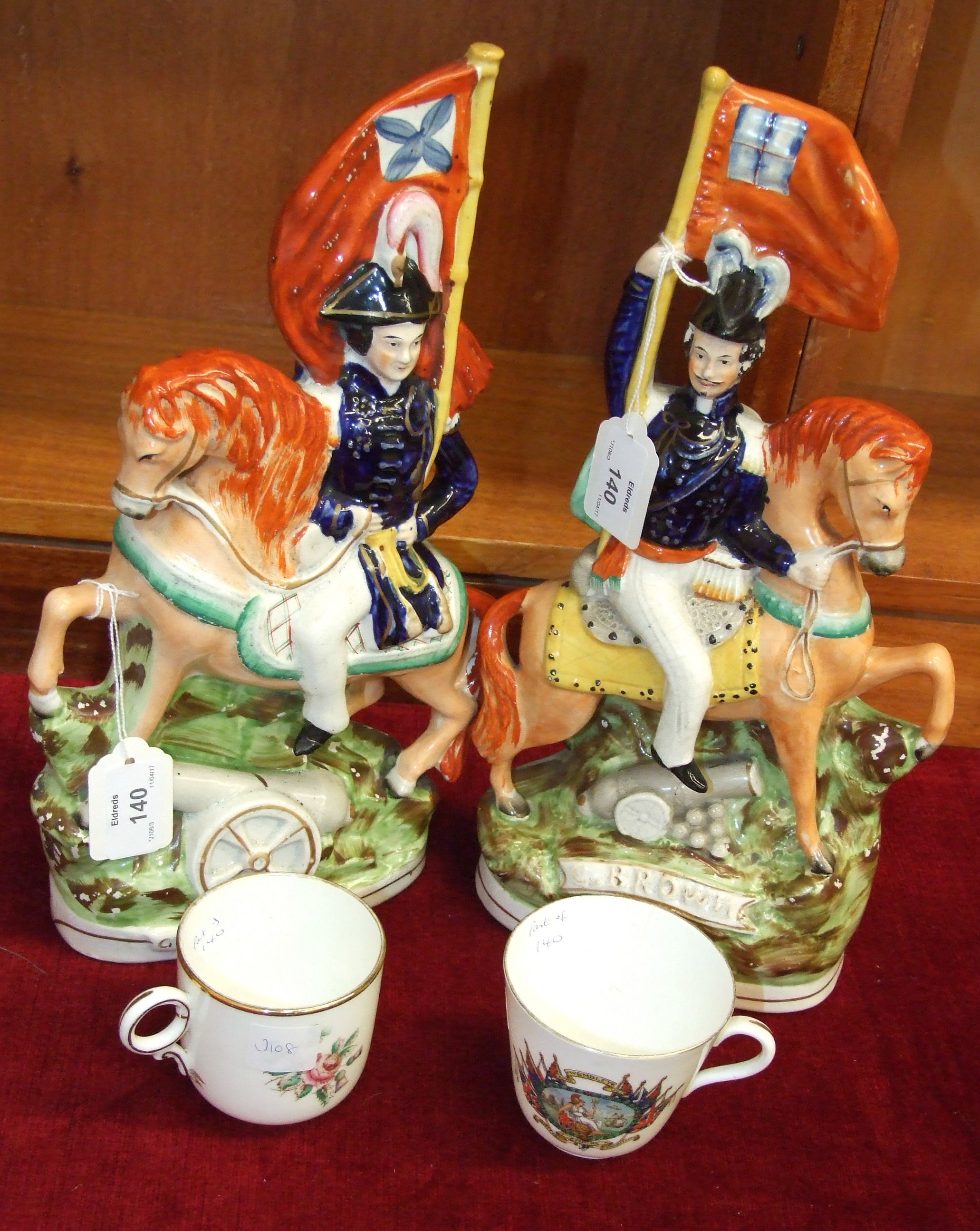 A Staffordshire Pottery equestrian figure of General Simpson with flag and cannon, decorated in