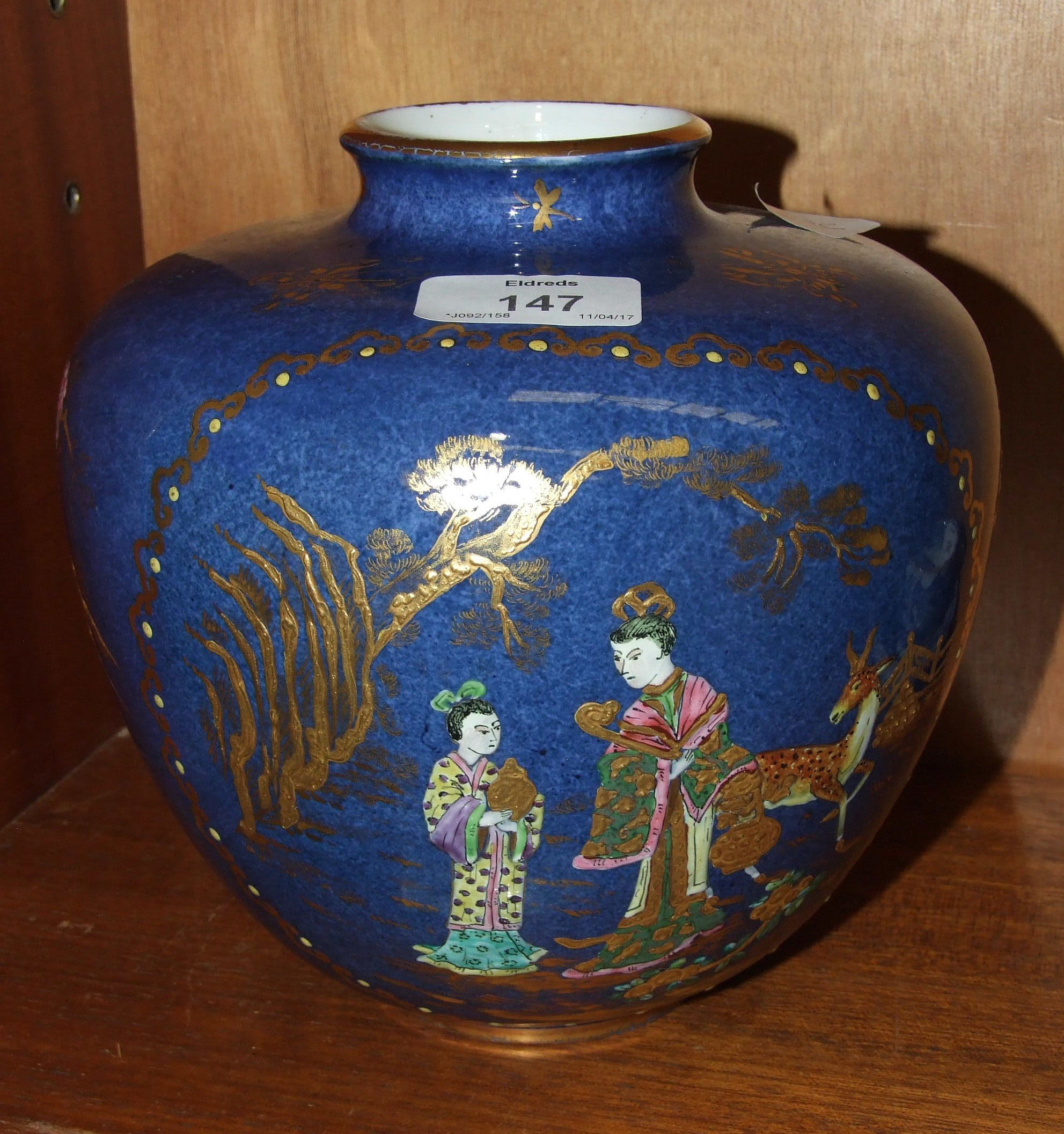A Carltonware-style baluster vase decorated in the oriental style with figures and a deer, 19cm