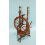 An antique turned wood spinning wheel, 88cm high, (a/f).