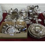 A collection of plated cutlery and other plated ware, including spill vases, bowls, a hot water jug,