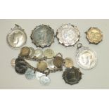 Six various silver coins in brooch and pendant mounts and other coin jewellery, 123g.