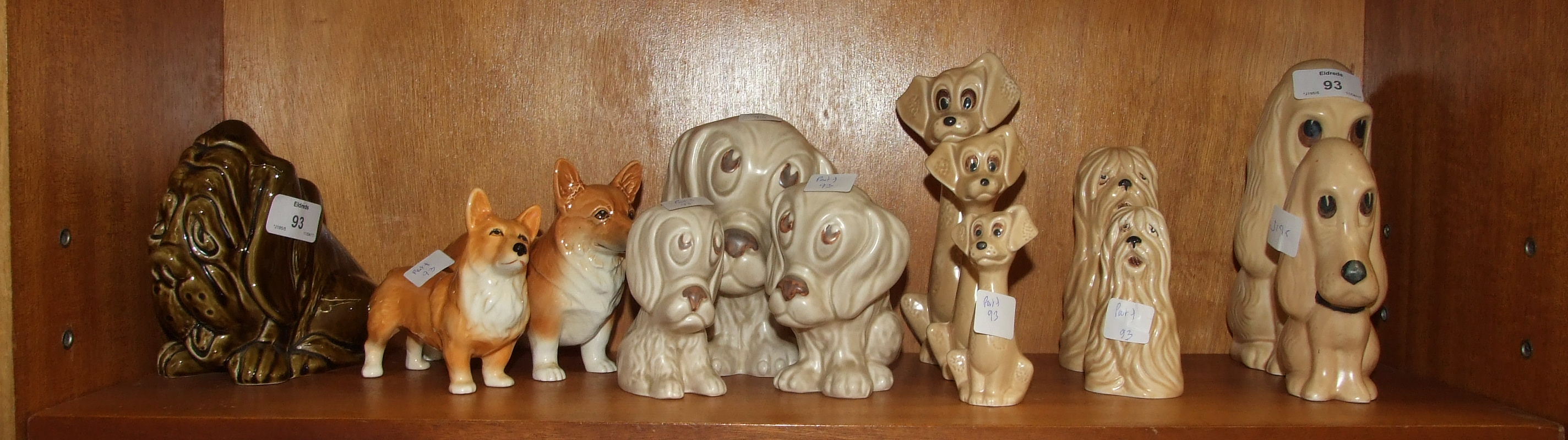 A collection of thirteen SylvaC dog ornaments, including bloodhound money box 5103, sad dog 2950,