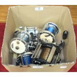 A collection of five multiplier fishing reels, including Garcia Mitchell 624 x2, 622, 602A and a G &