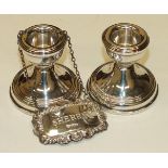 A pair of modern short silver candlesticks with loaded bases, Birmingham 1973 and a modern silver '