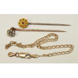 A gold stick pin set diamond and pearl cluster, another stick pin set ruby, 3.3g and a 14k gold