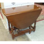 A mid-20th century mahogany low bookcase, the rectangular top above a pair of glazed doors, on base,