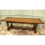 A reproduction oak refectory dining table on turned legs and H-stretcher, 259 x 84cm.