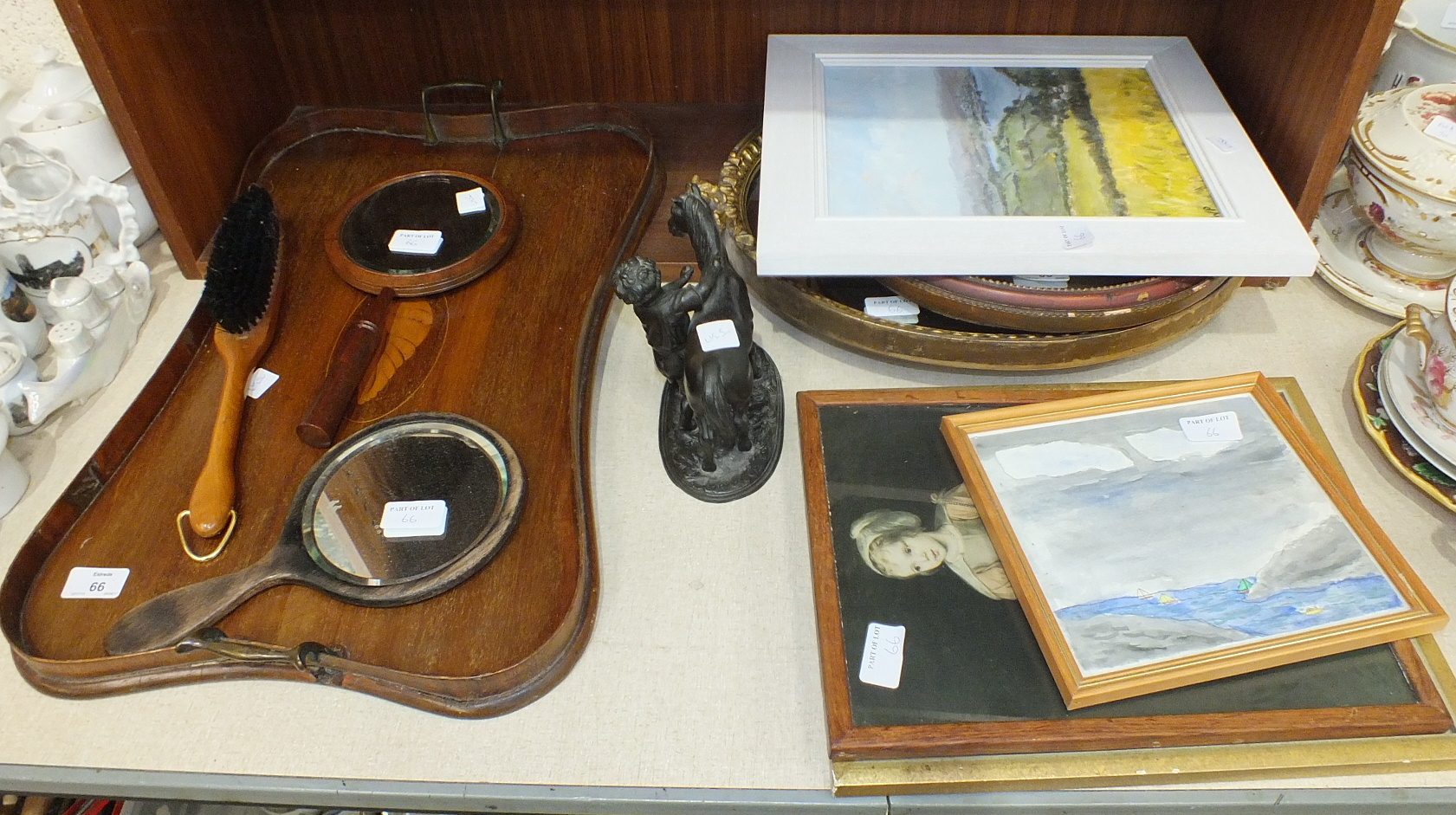 An inlaid mahogany rectangular waisted two-handled tray, 56 x 36cm, (a/f), two gilt frame wall