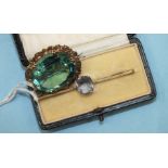 A 9ct gold bar brooch claw set a blue spinel, 3.7g, boxed and an oval brooch set large green/blue