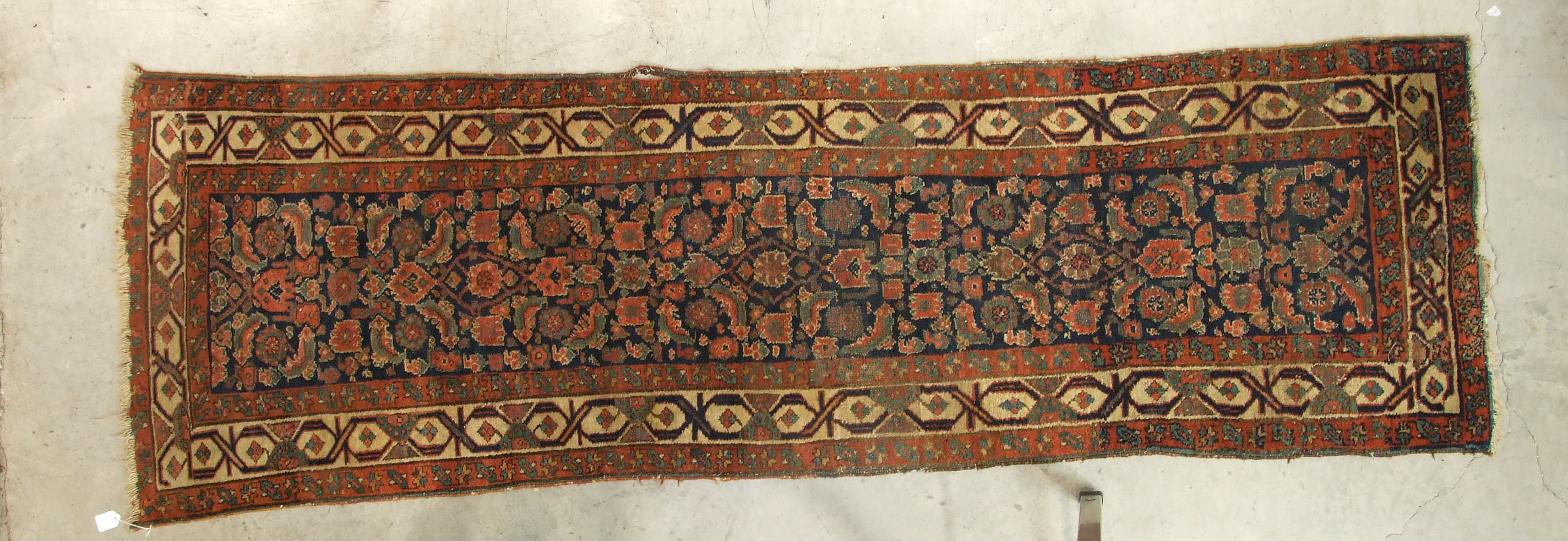 A mid-20th century Oriental runner decorated with six central hooked lozenge medallions, with a - Image 2 of 3