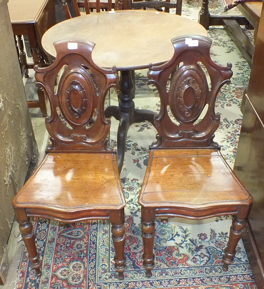 A 19th century mahogany circular table, the bird-cage action on turned column supported by three