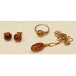 A small 9ct gold ring set amber, size L, an amber pendant on box link chain and a pair of 9ct gold