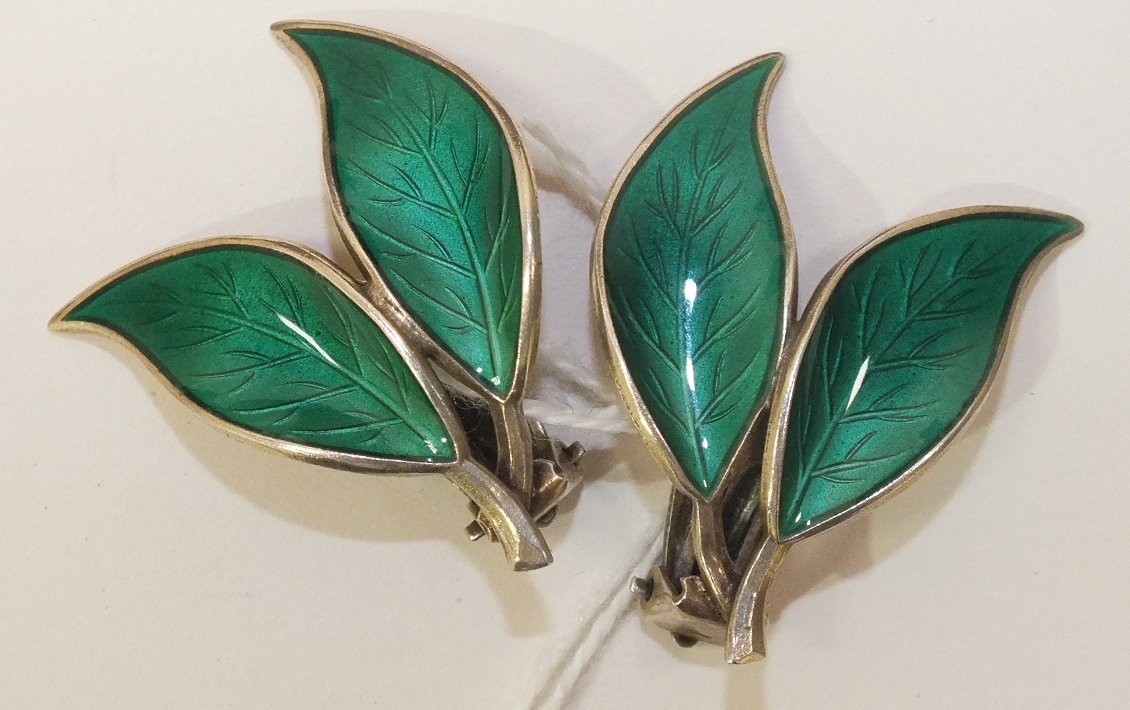 A pair of David Andersen green-enamelled silver double-leaf earrings.