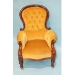 A Victorian mahogany button-back salon chair, the carved frame and serpentine seat on short turned