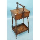 A Victorian walnut sewing box of tapered rectangular shape with two hinged inlaid flaps and carrying