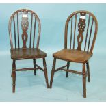 Two child's elm and beech wheel-back chairs, 61cm high, (2).