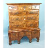 An early-18th century cross-banded and feather-banded walnut chest on stand.