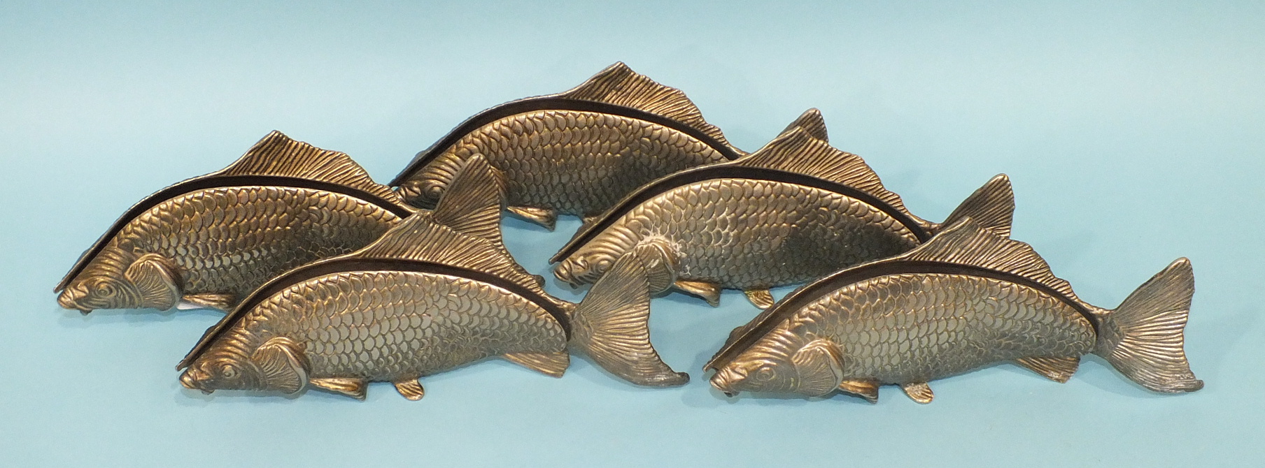Five Modello Depositato metal napkin holders in the form of fish, 24cm, (5).