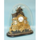 A 19th century French spelter mantel clock, the part-bronzed part-gilt figural case with two