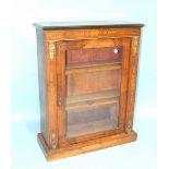 A Victorian inlaid walnut dwarf bookcase having a single glazed door and gilt metal mounts, 74cm