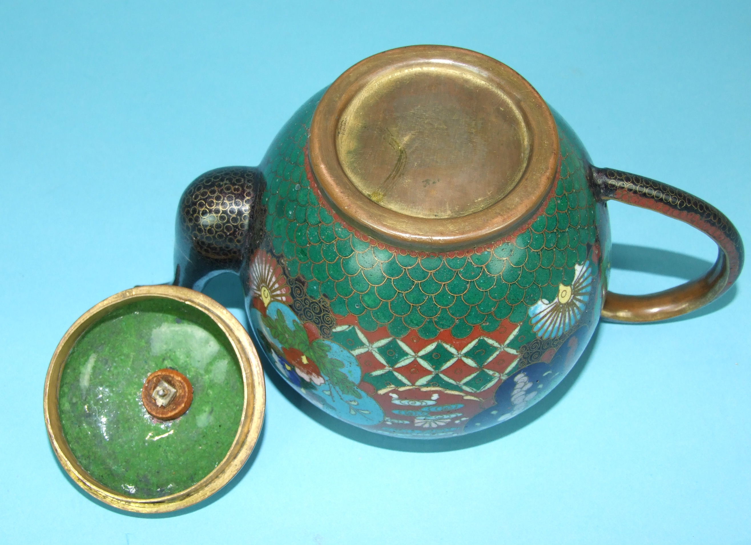 A 19th century Chinese cloisonné teapot and cover decorated with panels of flowers, on a brocade - Image 3 of 3
