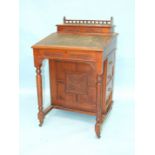A late-Victorian walnut Davenport writing desk, 56cm wide, 95cm high.