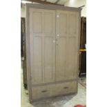 A large Victorian pine cupboard fitted with a pair of doors over a base drawer, 177cm wide, 213cm