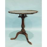 A Georgian mahogany bird-cage tilt-top table, the circular top with piecrust edge, on turned