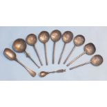 A collection of seven 17th century-style pewter spoons with plain handles, crowned rose touch mark
