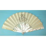 A 19th/20th century fan with mother-of-pearl guards and sticks and ivory silk leaf painted with a