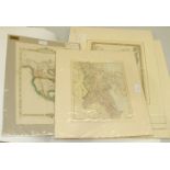 A collection of unframed mounted coloured world atlas maps.