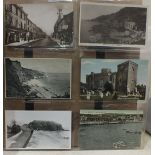 An album of 228 postcards of Devon, including many RPs.