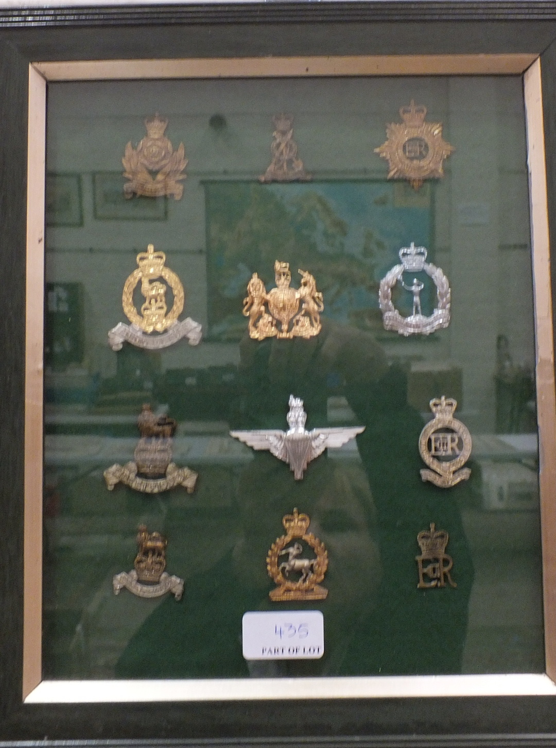 A collection of 117 various military badges contained in four glazed frames. - Image 2 of 4