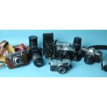 A collection of cameras and lenses, including Pentax P30 PentaxAsahi K1000 and Fujica ST605 cameras,