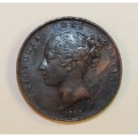 A Queen Victoria 1853 copper penny.