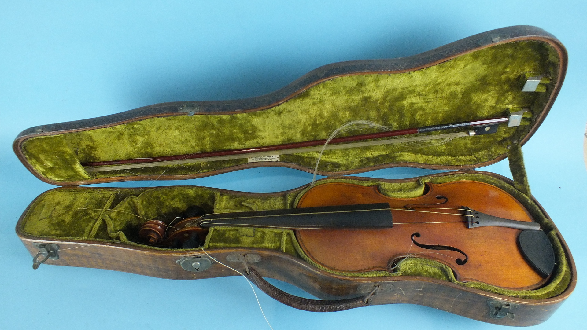 A full-size violin in case, with 25.5cm two-piece back, rosewood tuning pegs and bow.